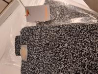 CS2091/2026   TRANSPARENT BAG WITH 2 SWEATERS INSIDE  BRAND ASSAI